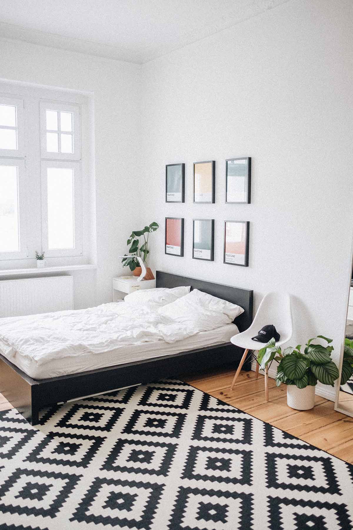 Master Bedroom white bed, black frame wall art